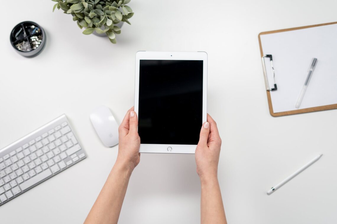 white ipad on white table