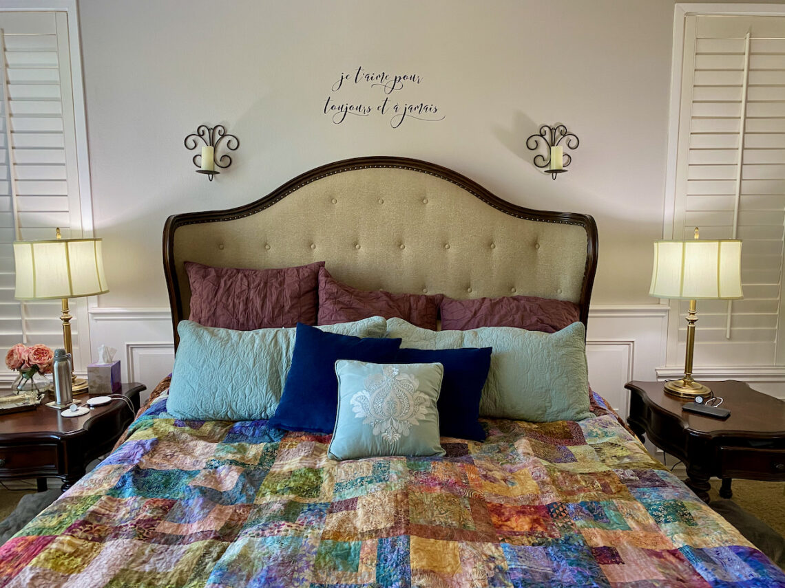 Picture of bed with quilt. Creating a private and comfortable bedroom oasis