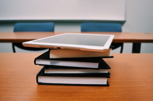 Books and tablet on table. Homeschool Classroom management one set of expectations