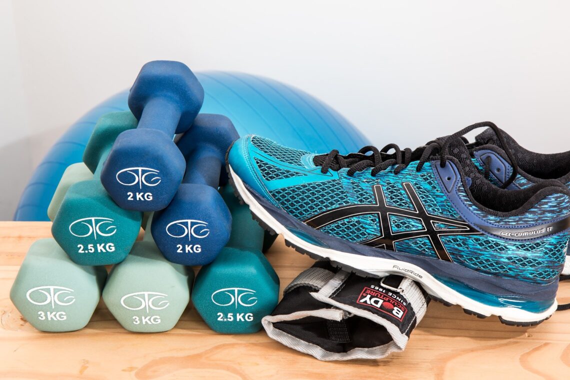 Dumbells and shoe. Fitness after breast cancer
