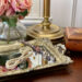 Flowers, Silver tray with jewelry and a wooden box on a nightstand. Dressing Beautifully, choosing a signature item