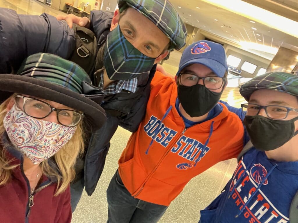 Author and family in Boise State Airport wearing masks.