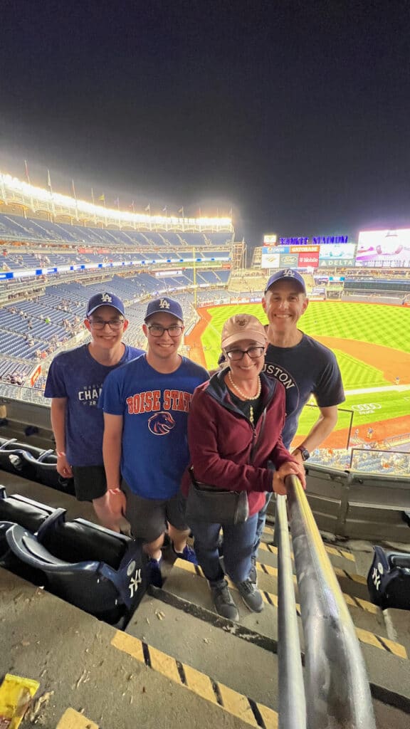 Family in a baseball stadium.  Living in the in-betweens