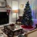 Photo of Author's living room with fireplace, Christmas tree and two couches. Progressive Christmas Decorating