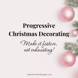 White backdrop with pine branches and pink christmas ornaments. Text reads progressive christmas decorating: Make it festive not exhausting