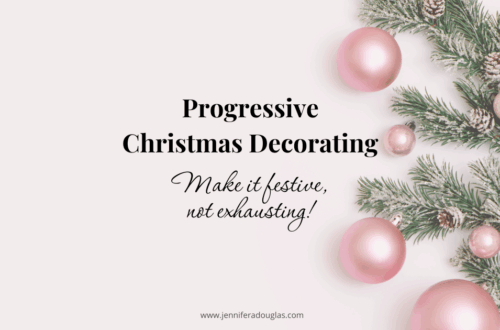 White backdrop with pine branches and pink christmas ornaments. Text reads progressive christmas decorating: Make it festive not exhausting