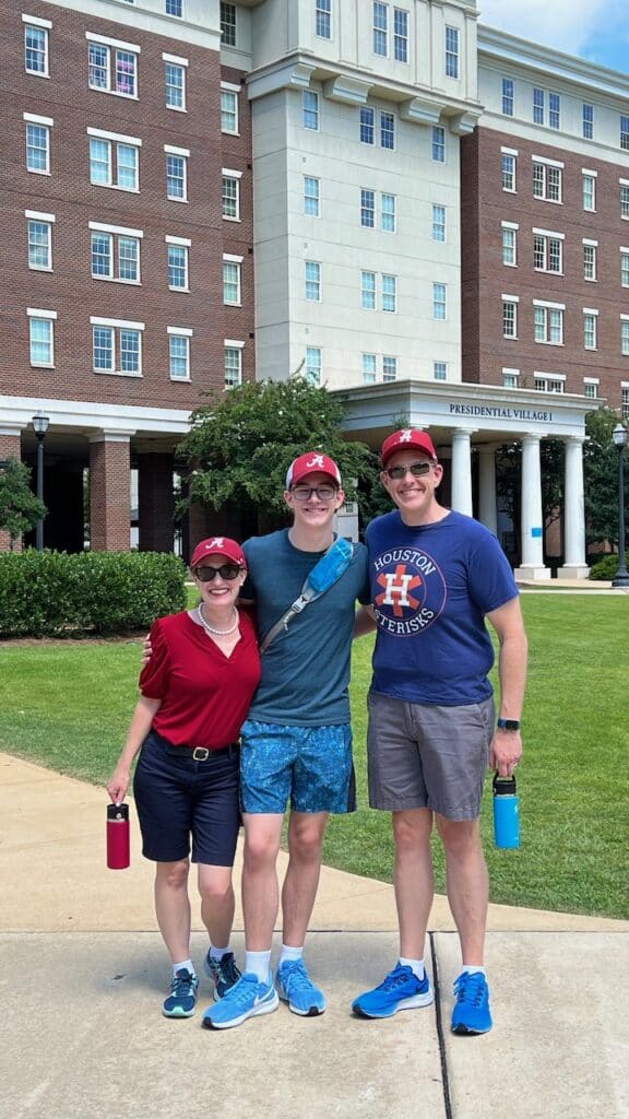 Author, son and husband outside the Alabama dorms