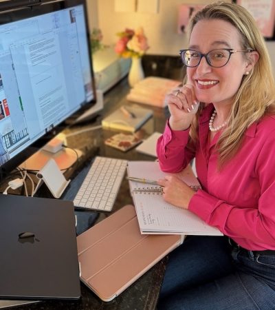 Jennifer Douglas writing at her desk, DCIS patient advocate and author